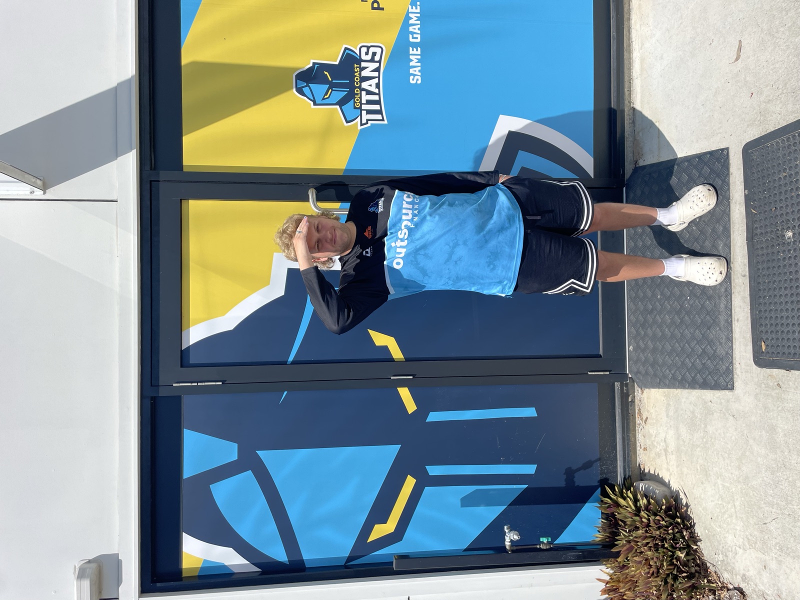 Hayden saluting outside the entrance to the Gold Coast Titans hub
